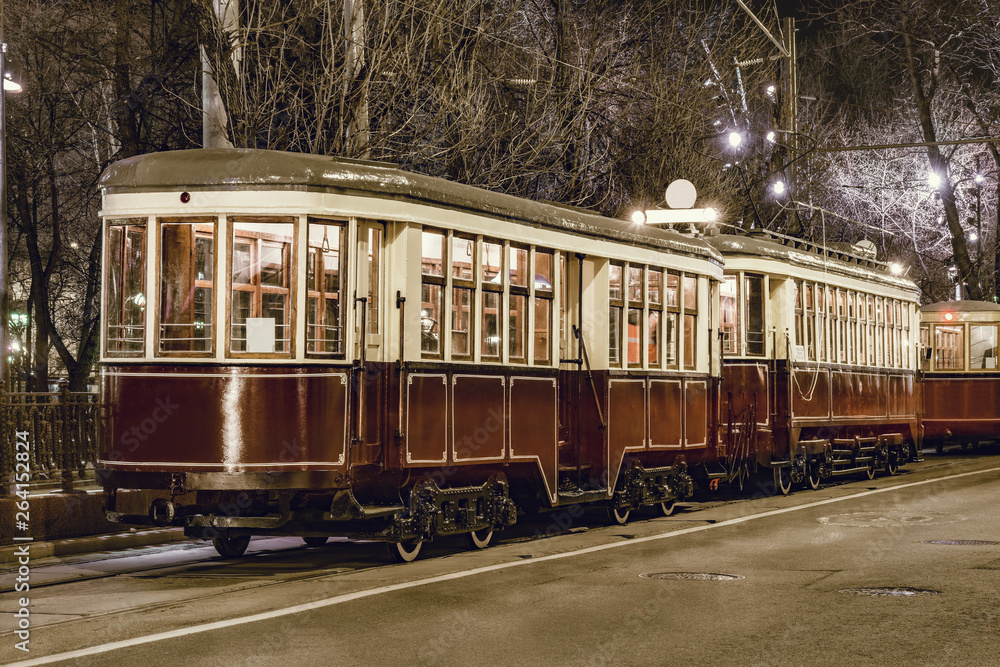 Old vintage tramway car on the night city street.