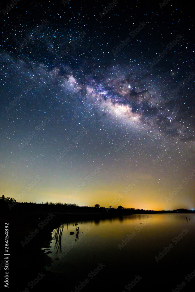 milky way at the lake with reflections in night time