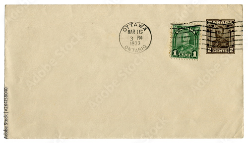 Ottawa, Ontario, Canada - 16 March 1933: canadian historical envelope: cover with brown imprinted stamp, two cents and green stamp one cent, George V profile, king of Great Britain, postal cancellat