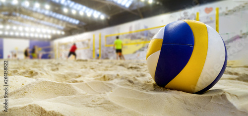 Schilderij op canvas indoor beach volleyball. ball in sand with copy space