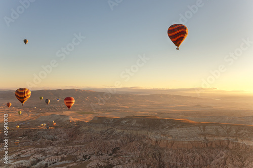 Hot Air Balloons Flying Over Cappadocia Turkey at sunrise