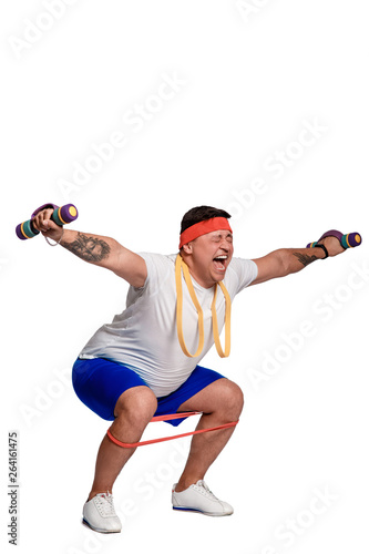 fat man exercising with dumbbells and looking at camera isolated on white
