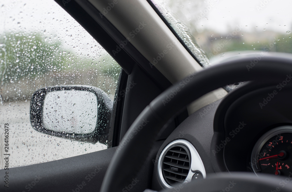Rain drops on car glass. Spring rain Rain drops on car glass. Spring rain