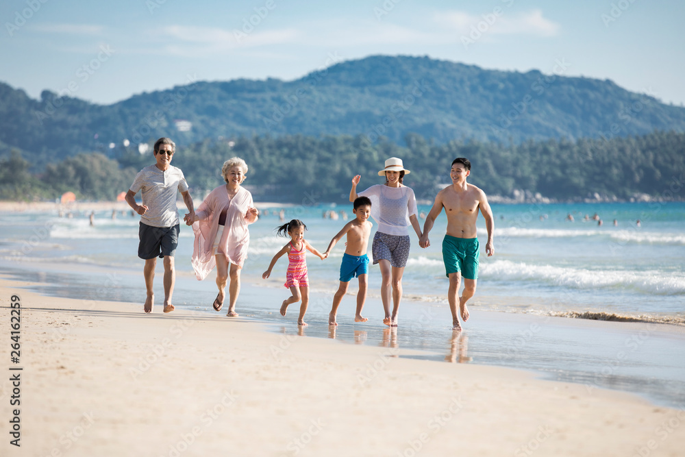 Happy family running on beach Happy family running on beach