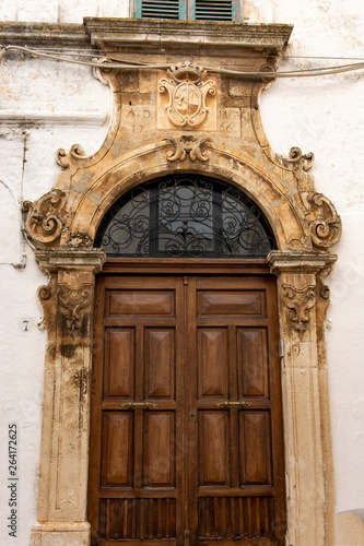 Italy, Ostuni, gate of an ancient building in the historic center