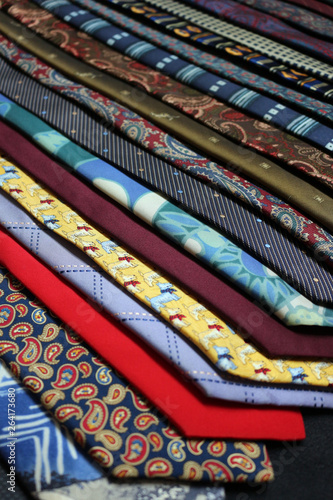 A row of different coloured and patterned ties