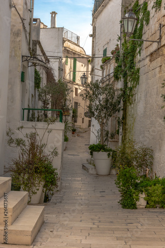 Fototapeta Naklejka Na Ścianę i Meble -  Italy, Ostuni, a typical street in the ancient historic center