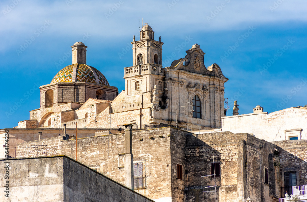 Italy, Ostuni, view of the historic center located on a hill.  Facade of the cathedral.