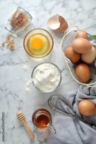 Ingredients for pancakes, cake, baking on a marble background. Top View