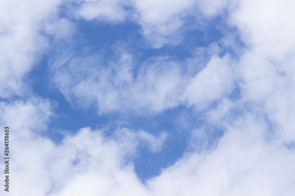 Obraz premium light white clouds in the sky in the shape of a heart a mystery of nature
