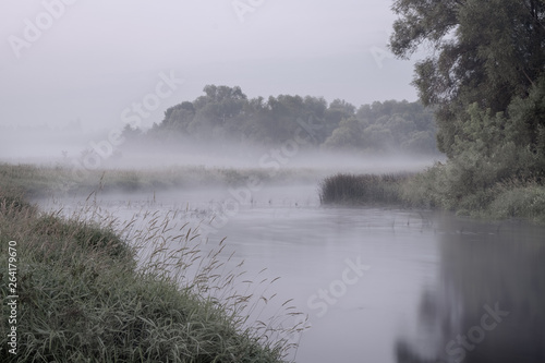 Fog at dusk on the river in the early morning