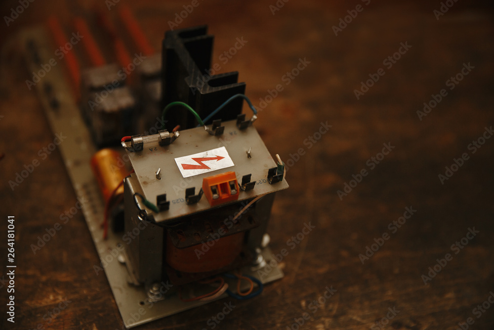 Fototapeta premium Electrician's workplace with soldering iron and printed circuit Board