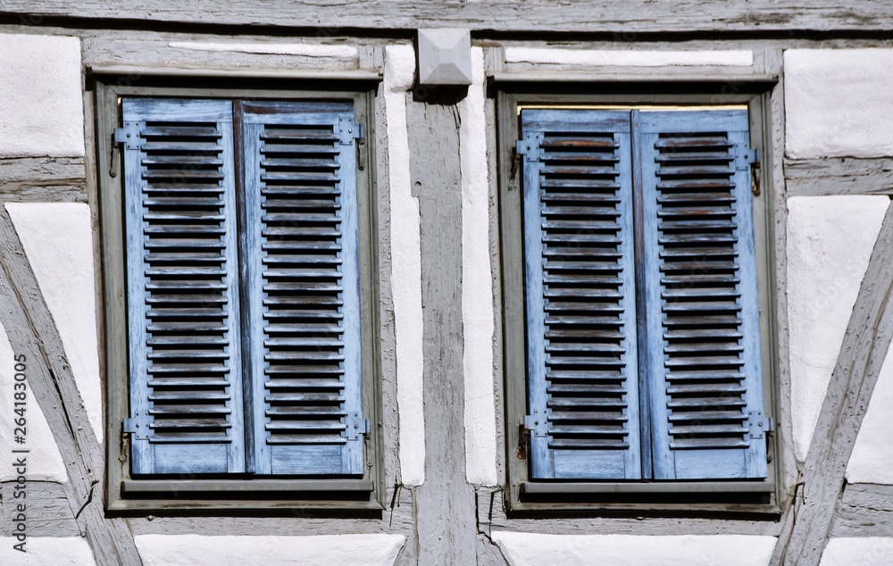 Close up of blue shutters on old timbered house