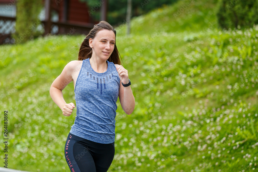 Young woman running in mountain european town in the morning Young woman running in mountain european town in the morning