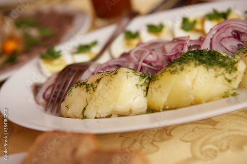 PLATE OF MARINATED HERRING WITH EGG AND POTATO IN MOSCOW RESTAURANT