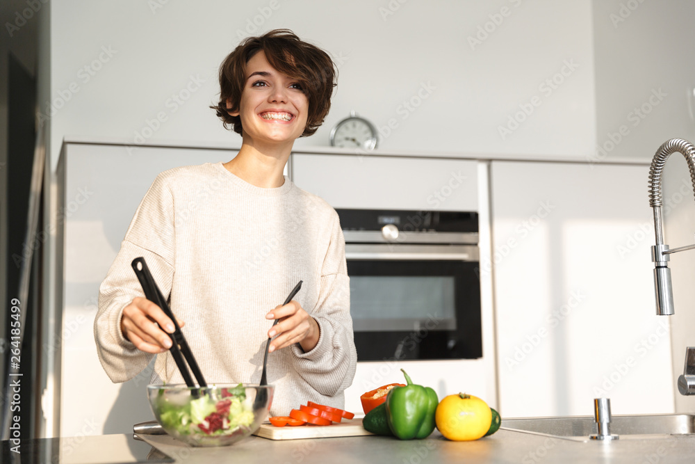 Picture of Happy brunette woman looking away