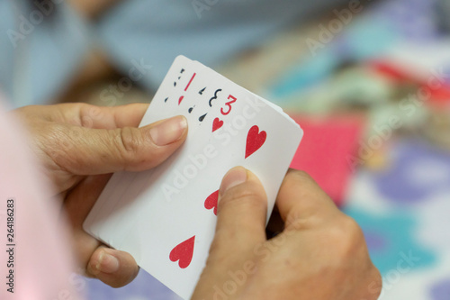 Playing cards in the hands