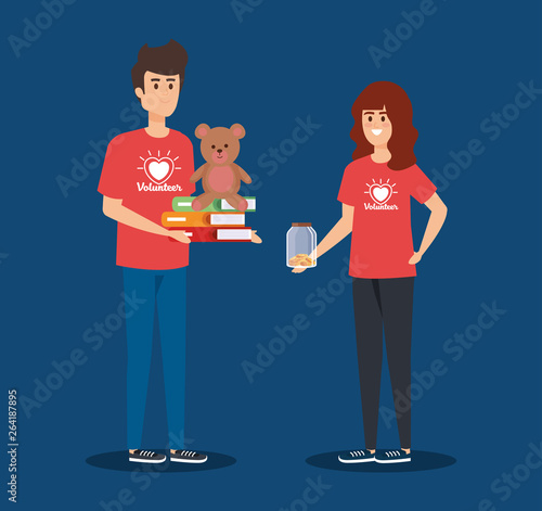 boy and girl volunteers with books and teddy