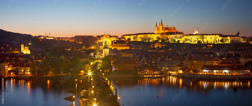 Prague - The Charles Bridge, Castle and Cathedral withe the Vltava river at dusk.