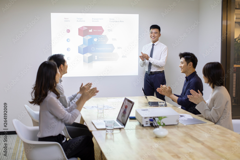 © Blue Jean Images - Business people having meeting in board room