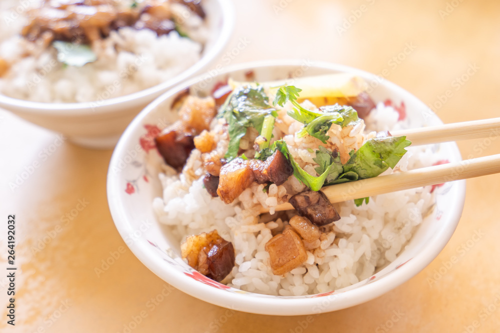 Braised pork over rice - Taiwan famous traditional street food delicacy. Soy-stewed pork on rice. Travel design concept. Top view,copy space,close up Braised pork over rice - Taiwan famous traditional street food delicacy. Soy-stewed pork on rice. Travel design concept. Top view,copy space,close up