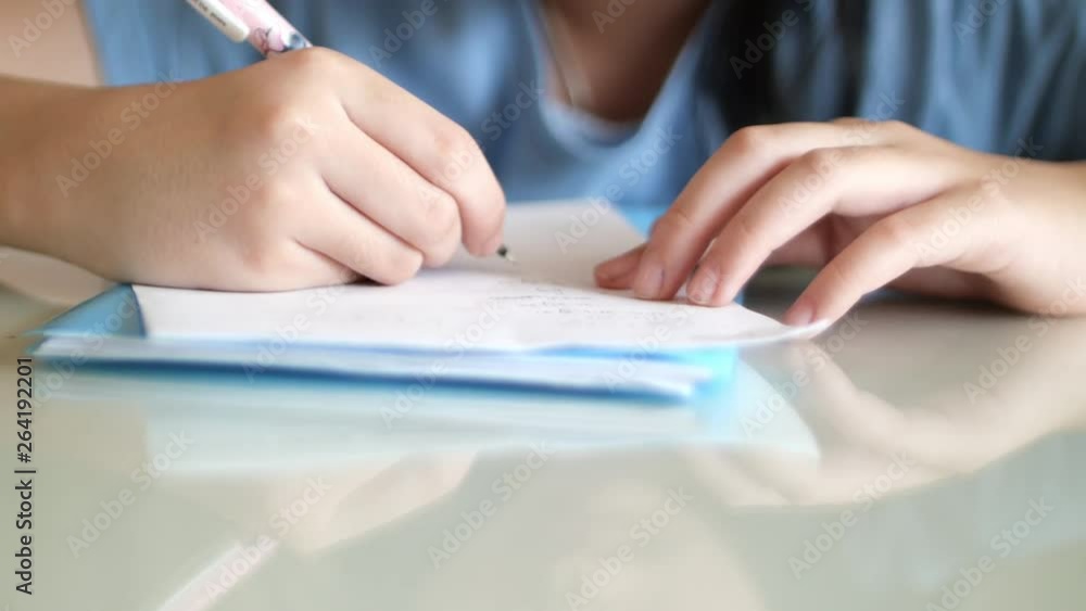 Young girl doing her homework after school Young girl doing her homework after school