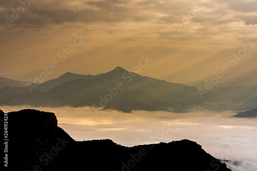 Sunrise with mist on hills 