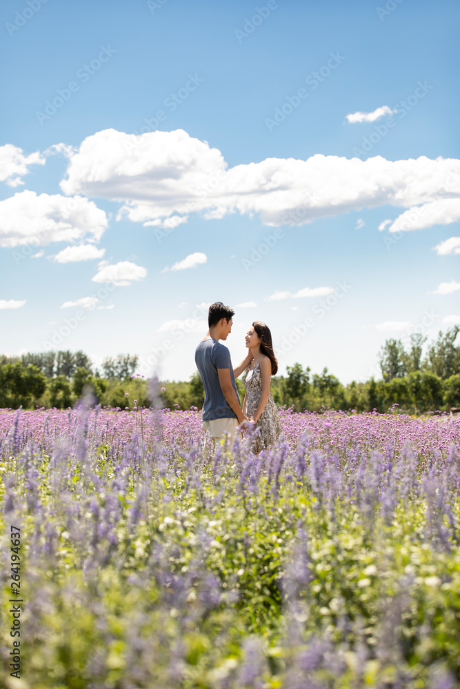 Happy young couple in lavender field Happy young couple in lavender field
