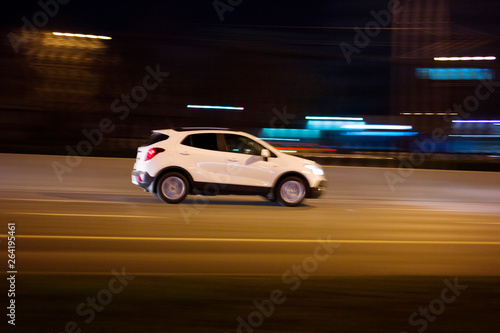The car rushes on the highway at high speed    Photo taken from the roadside  Moscow  spring 2019  sky  car  road 