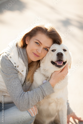 beautiful girl with a dog breed Golden Retriever best friends on a walk © serova_ekaterina