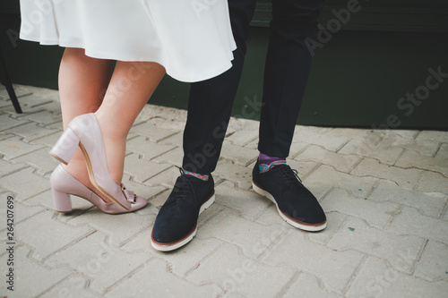 Bride and groom's feet and shoes