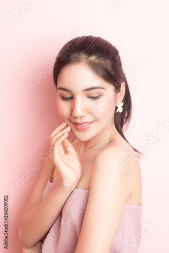 Beautiful Healthy young woman portrait  on pink  background
