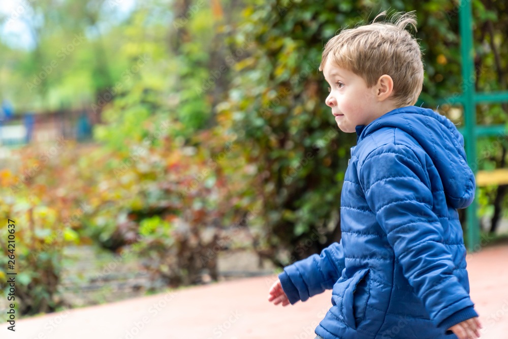 Small child running in a park