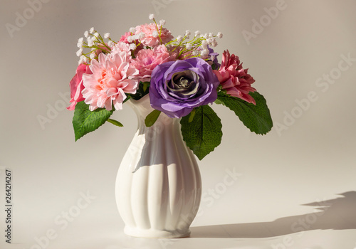 Wallpaper Mural Beautiful bouquet of flowers in a white vase on white background. Hard lights Torontodigital.ca