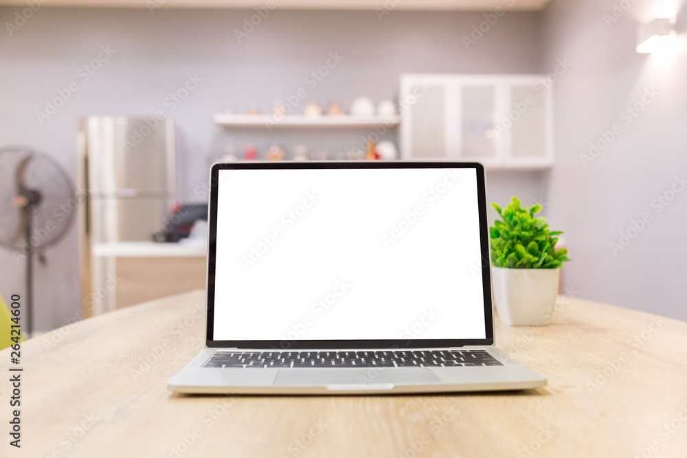 laptop showing blank screen on work table front view in home- Image