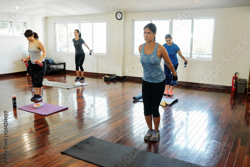 Women exercising in fitness club