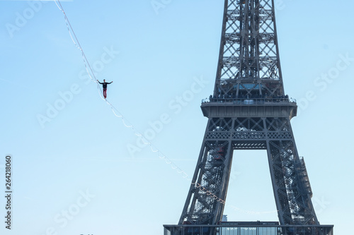 a man walk on a highline between Eiffel tower and Trocadero, Île de France, Paris, France photo