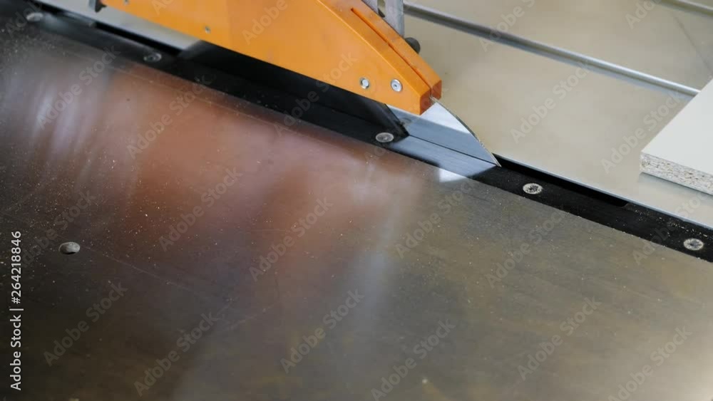 Carpenter cutting out chipboard sheet Carpenter cutting out chipboard sheet