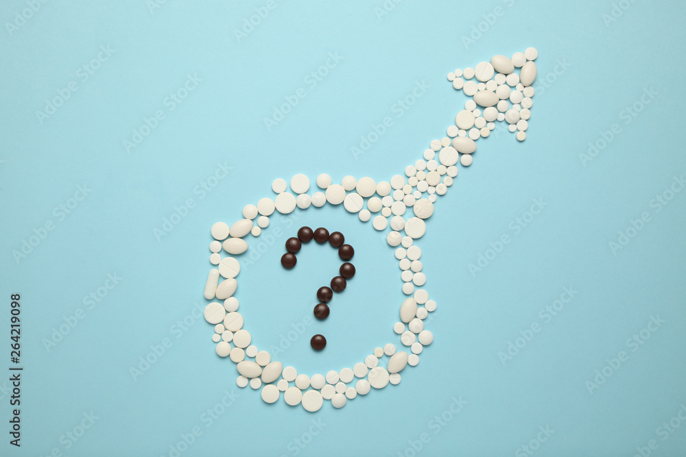 Obraz premium Pills in symbol of male. Male sexual dysfunction concept. Age problem of potence.