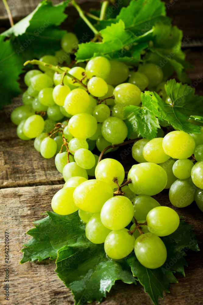 Ripe grapes on rustic wooden table. The concept of nutrition health, wine concept. Ripe grapes on rustic wooden table. The concept of nutrition health, wine concept.
