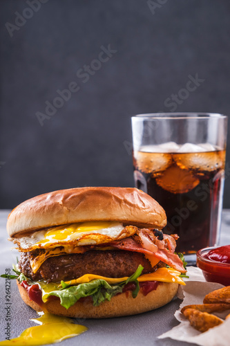 Homemade beef burger with bacon and egg. Fast food