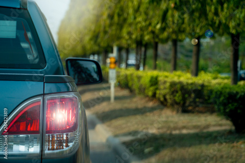 Gray pick up car on the road open light break. Trip to travel, with in the middle of the road and grass.