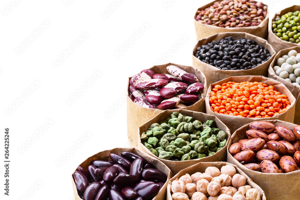 Various assortment set of indian legumes in paper sack bags isolated on white background.