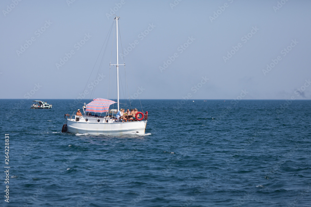 Seascape with pleasure yacht