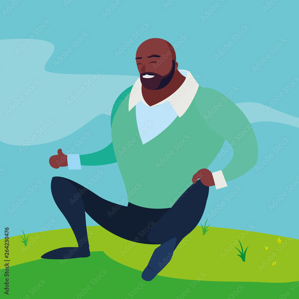 black strong and bearded man seated in the field black strong and bearded man seated in the field