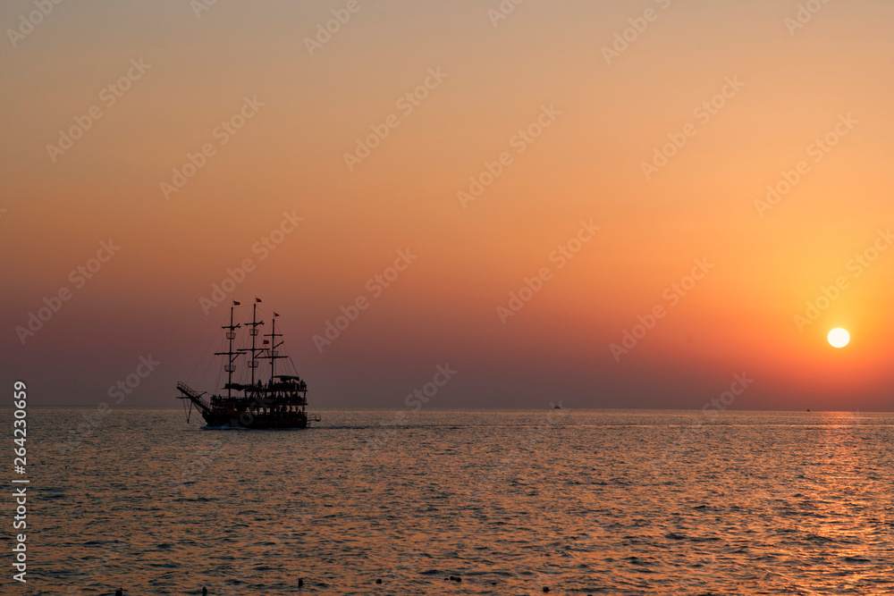 vintage boat in the sea. sunset