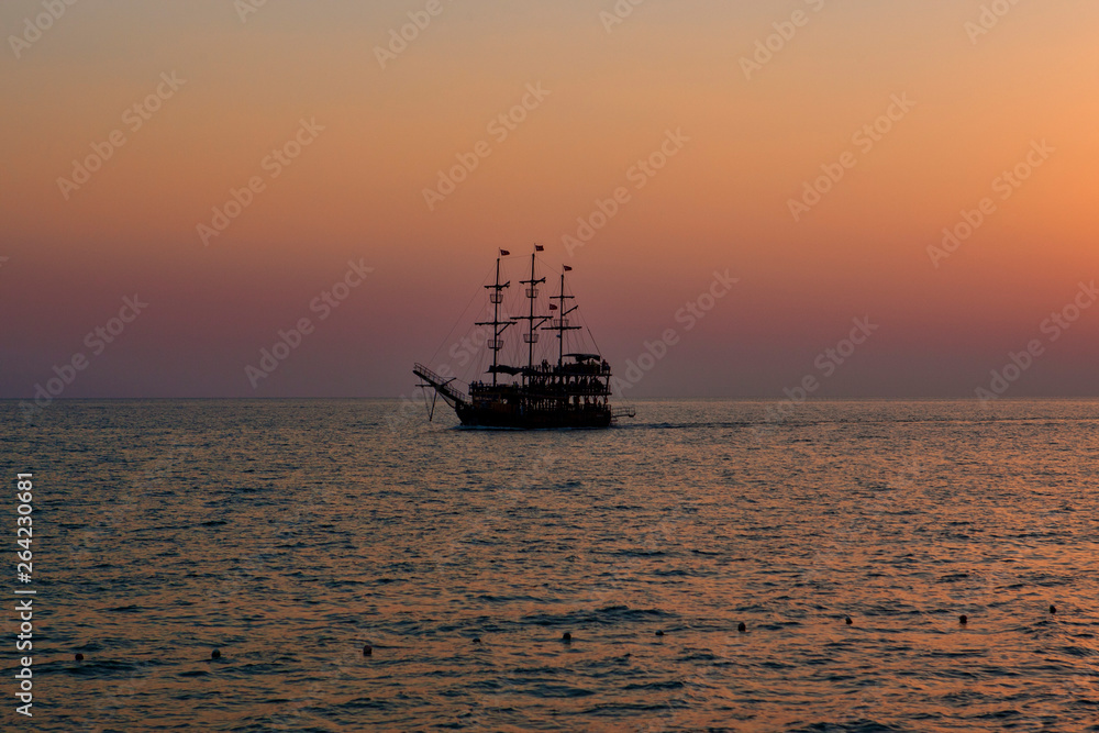 vintage boat in the sea. sunset