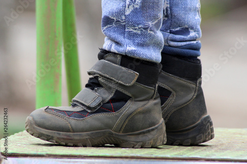 Demi-season leather shoes on children's feet