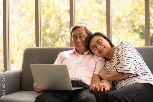 Senior couples relax on holiday with modern technologe