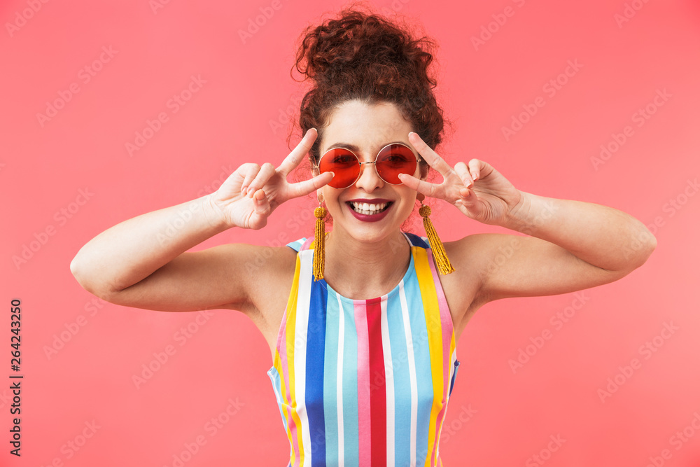 Happy pretty redhead woman wearing in dress and sunglasses Happy pretty redhead woman wearing in dress and sunglasses